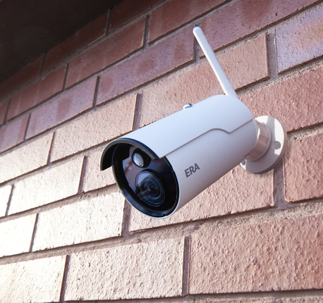 Outdoor security camera mounted on exterior wall