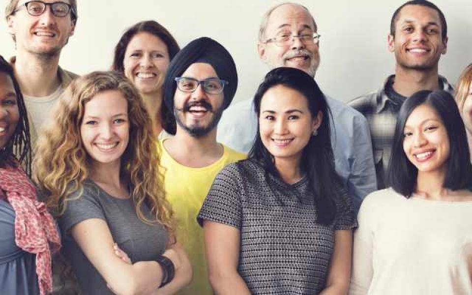 Stock photo of a group of people smiling at the camera
